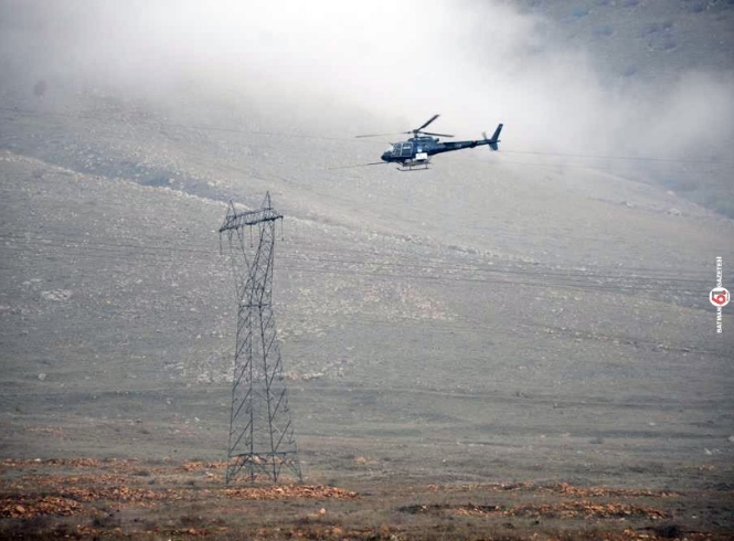 Helikopterle bakım onarım yapılıyor